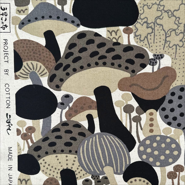 Selvage of Scandi Mushrooms Cotton Linen Canvas Fabric by Cotton Kobayashi, style UP-9014 B, featuring Scandinavian mushrooms, in brown and gray, imported from Japan