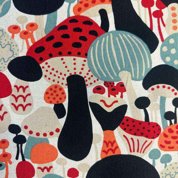 Close up of Scandi Mushrooms Cotton Linen Canvas Fabric by Cotton Kobayashi, style UP-9014A, featuring Scandinavian mushrooms, in natural and multi, imported from Japan