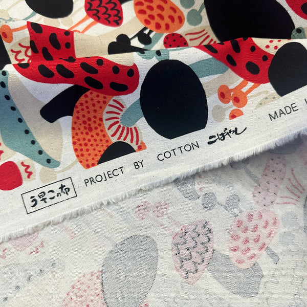 Selvage of Scandi Mushrooms Cotton Linen Canvas Fabric by Cotton Kobayashi, style UP-9014A, featuring Scandinavian mushrooms, in natural and multi, imported from Japan