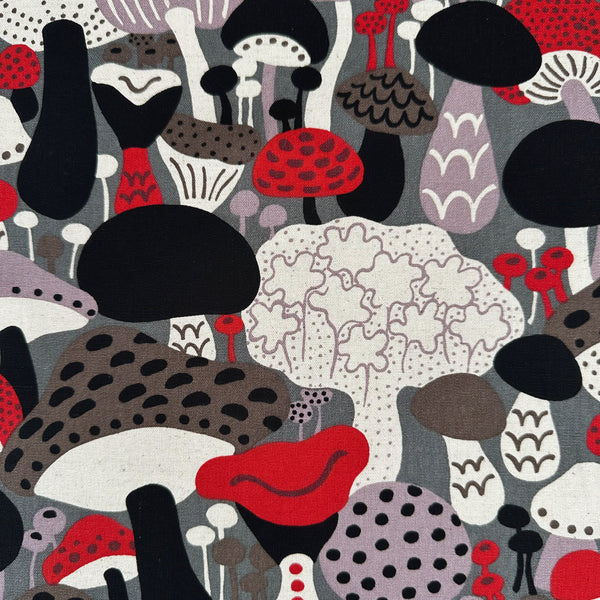 Close up of Scandi Mushrooms Cotton Linen Canvas Fabric by Cotton Kobayashi, style UP-9014C, featuring Scandinavian mushrooms, in gray and multi, imported from Japan