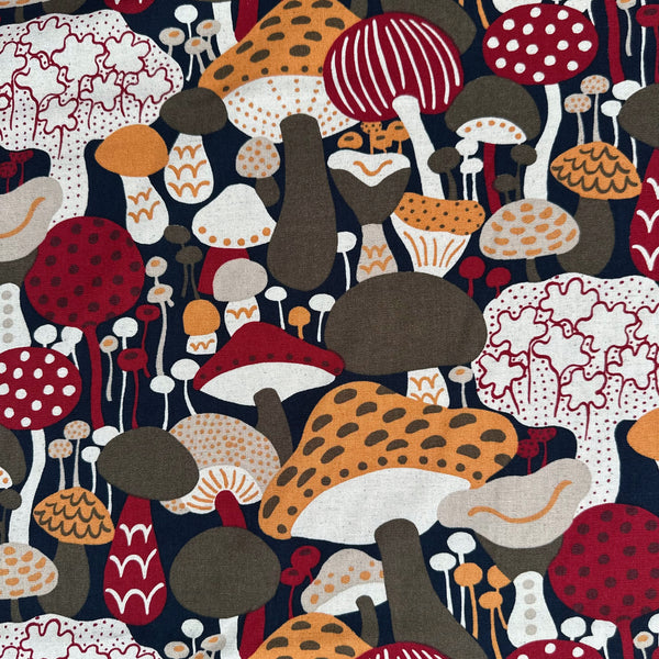 Scandi Mushrooms Cotton Linen Canvas Fabric by Cotton Kobayashi, style UP-9014D, featuring Scandinavian mushrooms, in navy and orange, imported from Japan