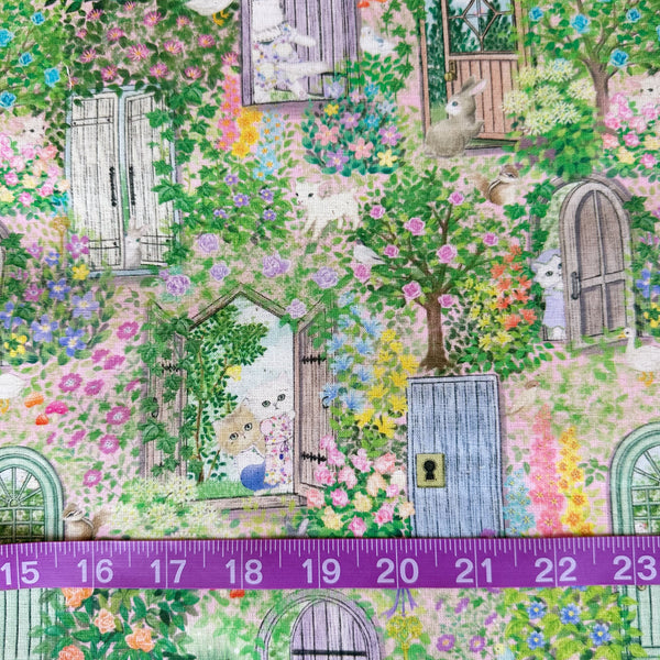 Scale of Secret Garden Cotton Linen Fabric by Yukiemon for Hokkoh featuring whimsical cats, rabbits, and birds peeking from windows and doorways.