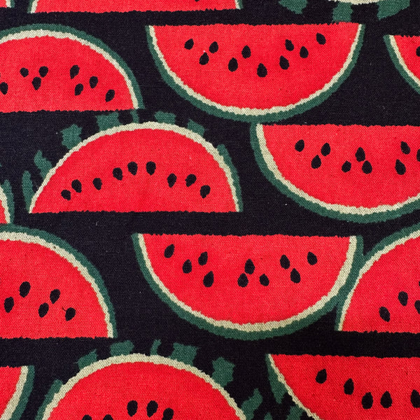 Close up of Red Watermelons on Black cotton linen canvas fabric by Sevenberry, Japanese import with watermelon print on black background