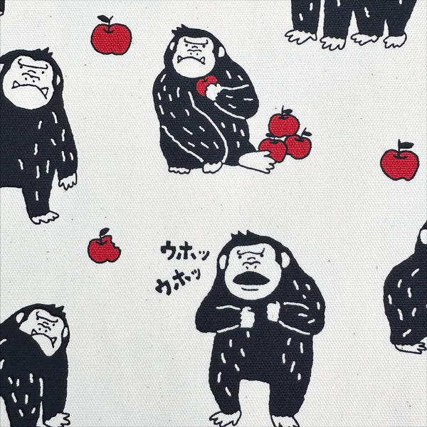 Close up of Silly Gorilla Cotton Oxford Fabric in White by Cosmo Textiles featuring animated gorillas and apples on a white background.
