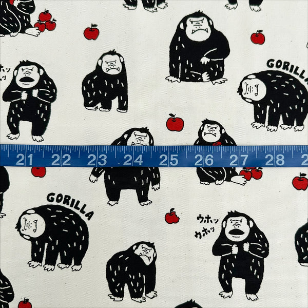 Scale of Silly Gorilla Cotton Oxford Fabric in White by Cosmo Textiles featuring animated gorillas and apples on a white background.