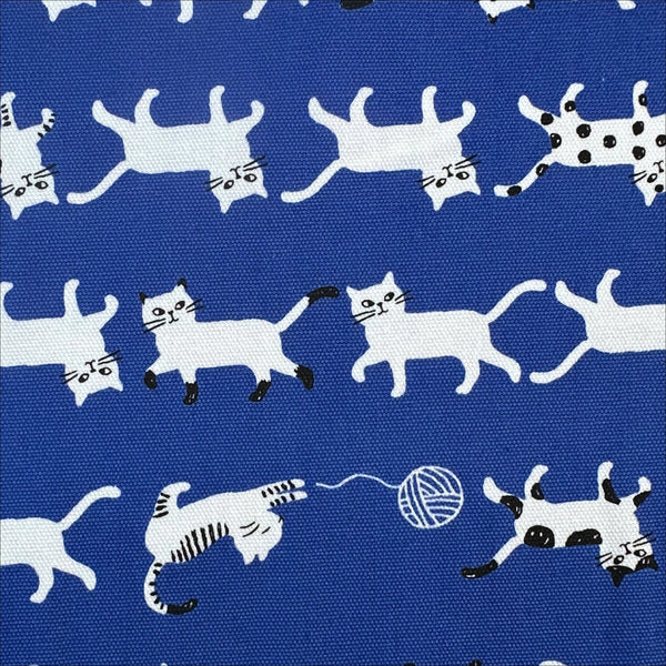 Close up of Simply Palette Cats Cotton Oxford fabric by Kokka, style YPA-69010-1 E, in blue and white