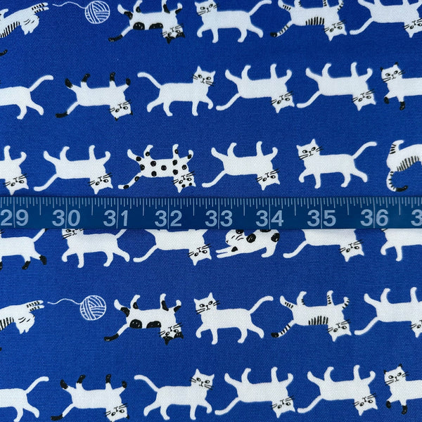 Scale of Simply Palette Cats Cotton Oxford fabric by Kokka, style YPA-69010-1 E, in blue and white