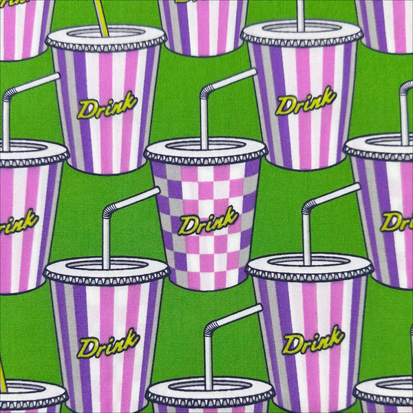 Close up of Soda Drink cotton broadcloth fabric in green by Sevenberry, Japanese import featuring a retro pop art soda cup print