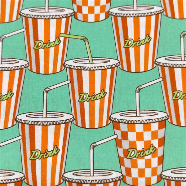 Close up of Soda Drink cotton broadcloth fabric in mint by Sevenberry, Japanese import featuring a retro pop art soda cup print