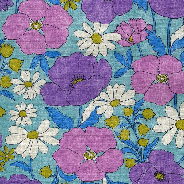 Close up of Sopo Retro Vintage Floral Cotton Dobby Fabric in Blue by Kokka Japanese import with rustic floral print and textured dobby weave
