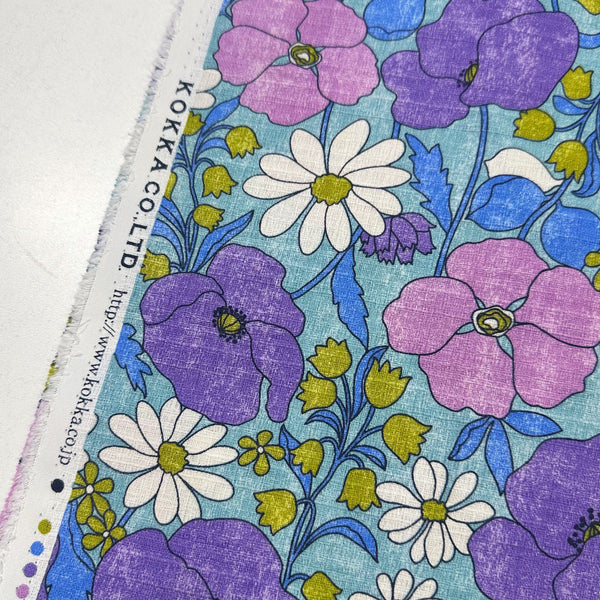 Selvage of Sopo Retro Vintage Floral Cotton Dobby Fabric in Blue by Kokka Japanese import with rustic floral print and textured dobby weave