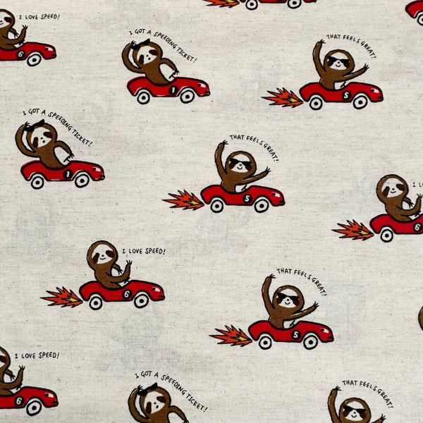 Speedy Sloth Cotton Linen Blend Fabric by Cosmo Textiles, style AP65204 2A, featuring sloths in red racing cars, in natural