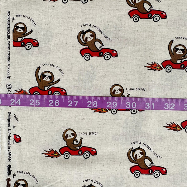 Scale of Speedy Sloth Cotton Linen Blend Fabric by Cosmo Textiles, style AP65204 2A, featuring sloths in red racing cars, in natural