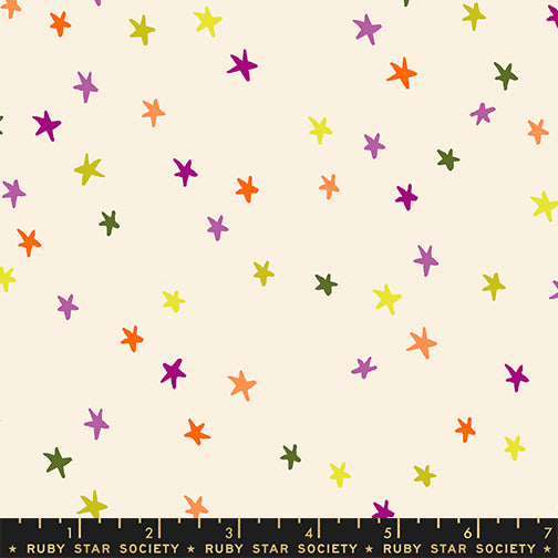 Scale of Starry cotton fabric by Ruby Star Society featuring tiny multicolored stars.