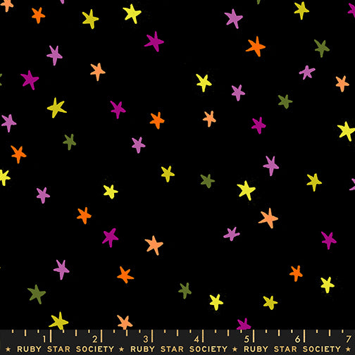 Scale of Starry cotton fabric by Ruby Star Society featuring tiny multicolored stars on a spooky black background.