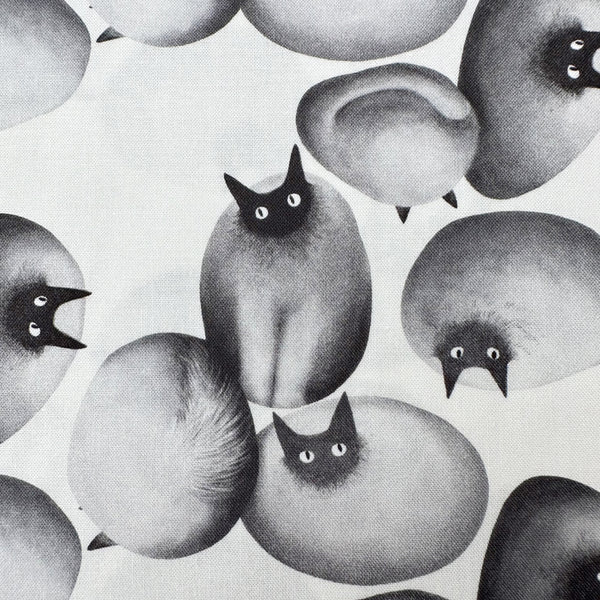 Close up of Stone Cats cotton fabric in Gray by Nora featuring round stone cats with a quirky, surreal charm and slightly eerie appeal