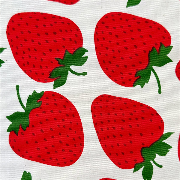 Close up of Strawberries Cotton Oxford fabric by Sevenberry, style B850592Z 1-2, in natural