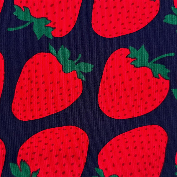 Close up of Strawberries Cotton Oxford fabric by Sevenberry, style B850592Z 1-4, in navy