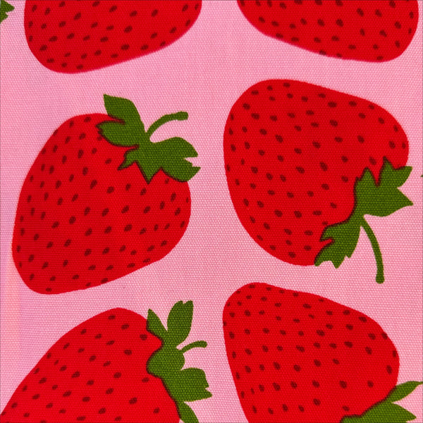 Close up of Strawberries Cotton Oxford fabric by Sevenberry, style B850592Z 1-3, in pink