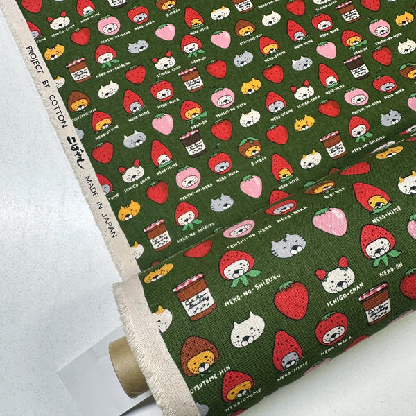 Bolt of Strawberry Cats canvas fabric by Cotton Kobayashi, cotton linen blend with playful cats dressed as strawberries