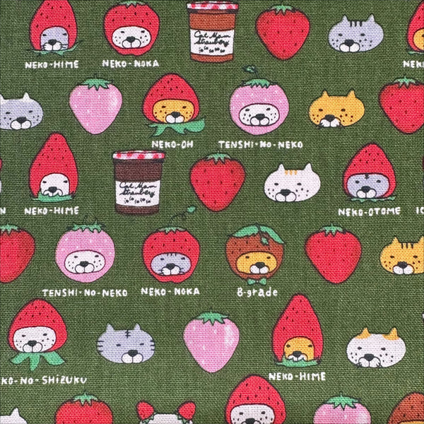 Close up of Strawberry Cats canvas fabric by Cotton Kobayashi, cotton linen blend with playful cats dressed as strawberries