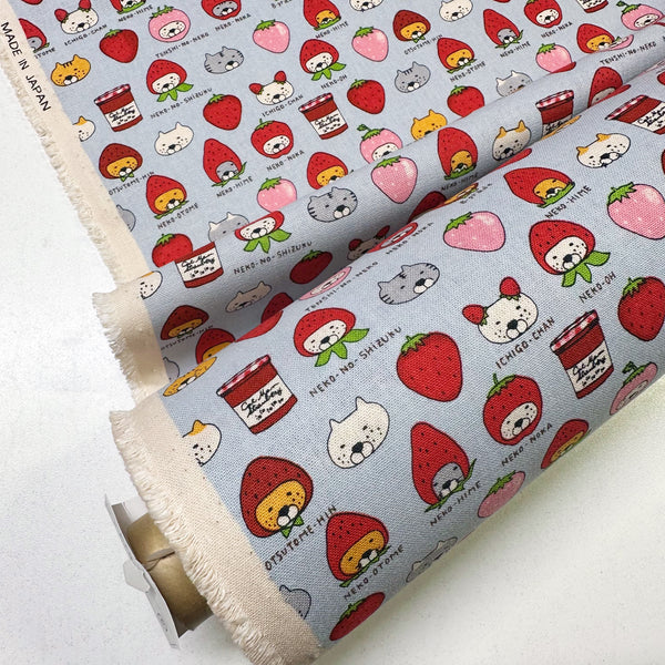Bolt of Strawberry Cats canvas fabric by Cotton Kobayashi, cotton linen blend with playful cats dressed as strawberries