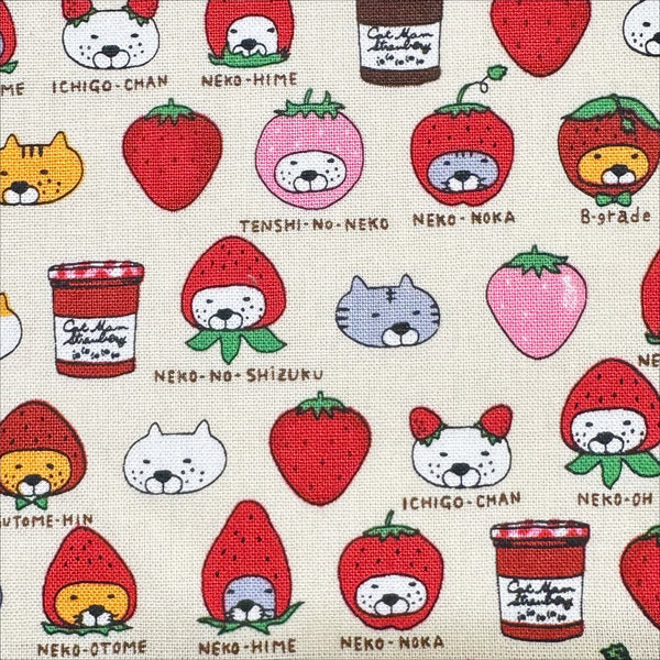 Close up of Strawberry Cats canvas fabric by Cotton Kobayashi, cotton linen blend with playful cats dressed as strawberries