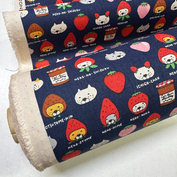 Bolt of Strawberry Cats canvas fabric by Cotton Kobayashi, cotton linen blend with playful cats dressed as strawberries