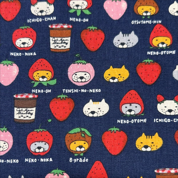 Close up of Strawberry Cats canvas fabric by Cotton Kobayashi, cotton linen blend with playful cats dressed as strawberries