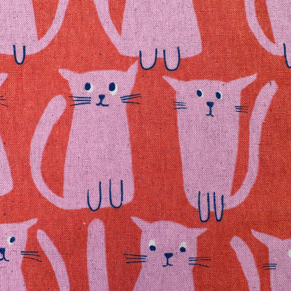 Close up of Stray Cat Friends Cotton Linen Canvas fabric by Sevenberry, style 850615, in coral and pink