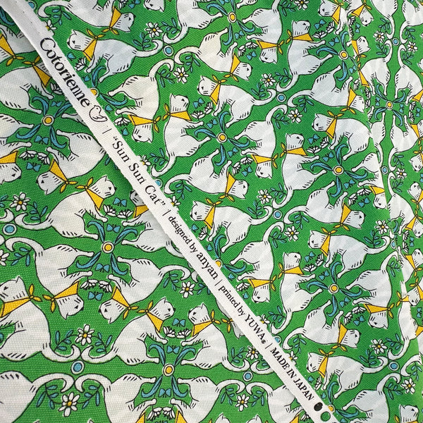 Selvage of Sun Sun Cat cotton oxford fabric by Yuwa in green, CO-159219-A
