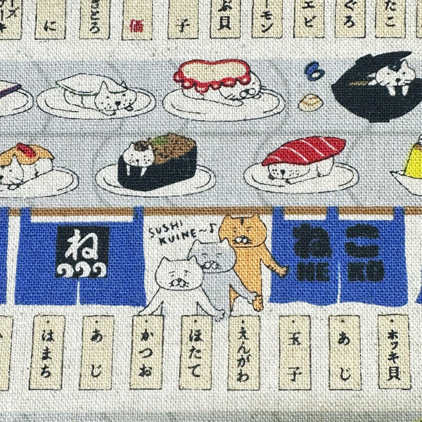 Close up of Sushi Cats canvas fabric in blue cotton linen blend by Cotton Kobayashi featuring playful cats and sushi illustrations