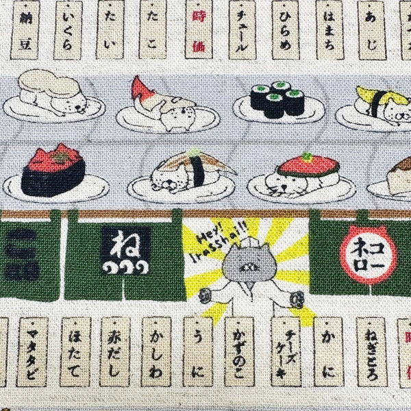 Close up of Sushi Cats canvas fabric in green cotton linen blend by Cotton Kobayashi featuring playful cats and sushi illustrations