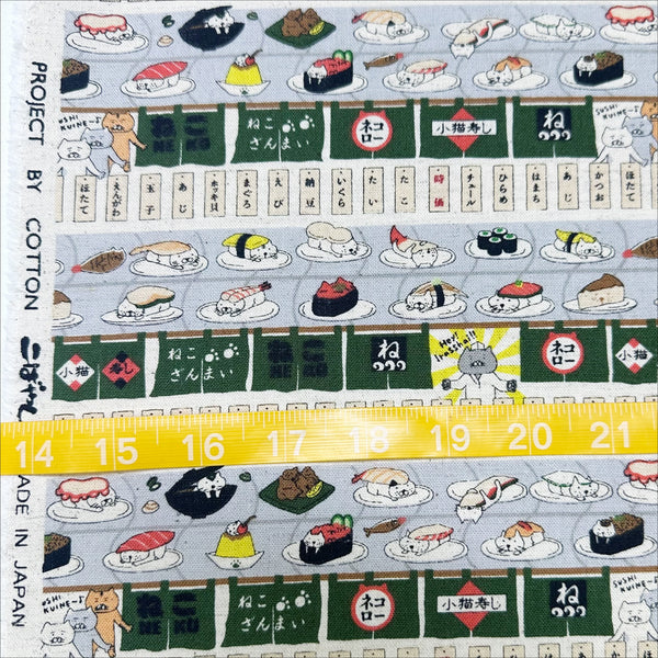 Scale of Sushi Cats canvas fabric in green cotton linen blend by Cotton Kobayashi featuring playful cats and sushi illustrations