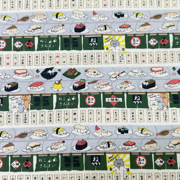 Sushi Cats canvas fabric in green cotton linen blend by Cotton Kobayashi featuring playful cats and sushi illustrations