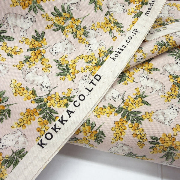 Selvage of Sweeties Mimosa Cats cotton oxford fabric by Kokka in pale pink, YKA-46020-1B
