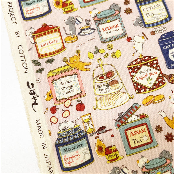 Selvage of Tea Cats Canvas Fabric in Pink by Cotton Kobayashi – silly cats playing and drinking tea on cotton linen canvas, imported from Japan
