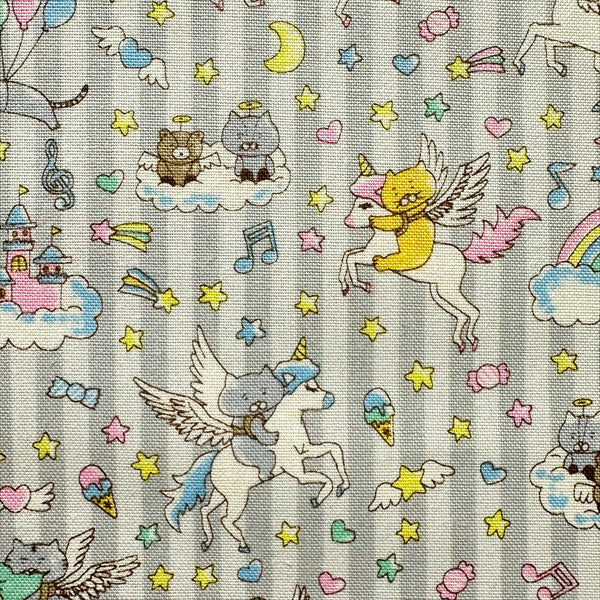 Close up of Unicorn Cats cotton linen blend canvas fabric in light gray by Cotton Kobayashi featuring whimsical cat and unicorn illustrations