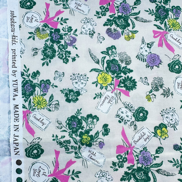 Selvage of Wild Flower Bouquet cotton fabric in Cream by Sobakasu Kids for Yuwa Fabrics featuring a detailed floral bouquet print