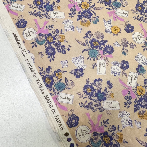 Selvage of Wild Flower Bouquet cotton fabric in tan by Sobakasu Kids for Yuwa Fabrics