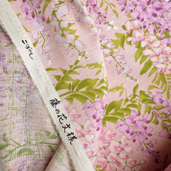 Selvage of Wisteria Cotton Dobby Fabric by Cotton Kobayashi, style KTS7191-B, featuring wisteria blossoms, in pink, imported from Japan