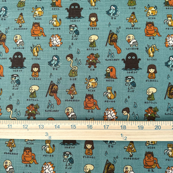 Scale of Yokai Guide Cotton Dobby Fabric by Cosmo Textiles, style AP62206 2B, featuring Japanese folklore spirits and monsters, in dusty jade, imported from Japan